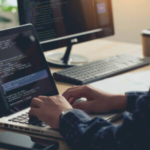 Professional Development programmer typing on a laptop Computer Keyboard. Screens Show Coding Language User Interface. Program Development, software, and coding technology, artificial chat, Website design.